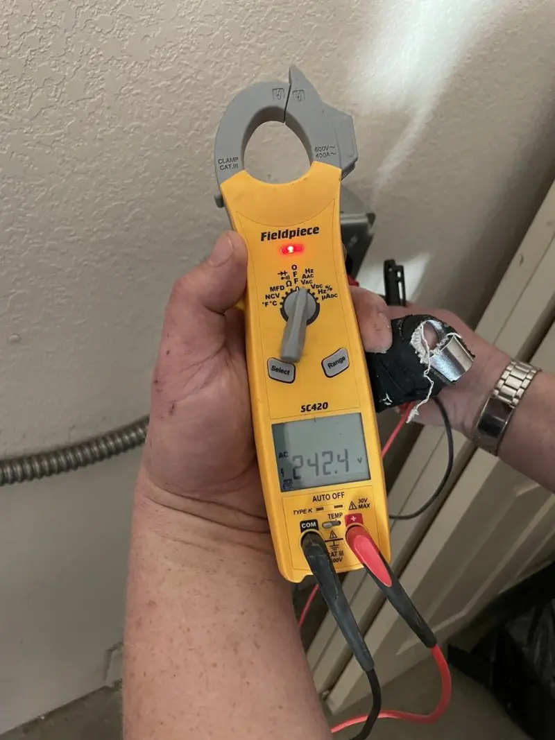 Voltage testing with clamp meter during Outlet Installation in League City
